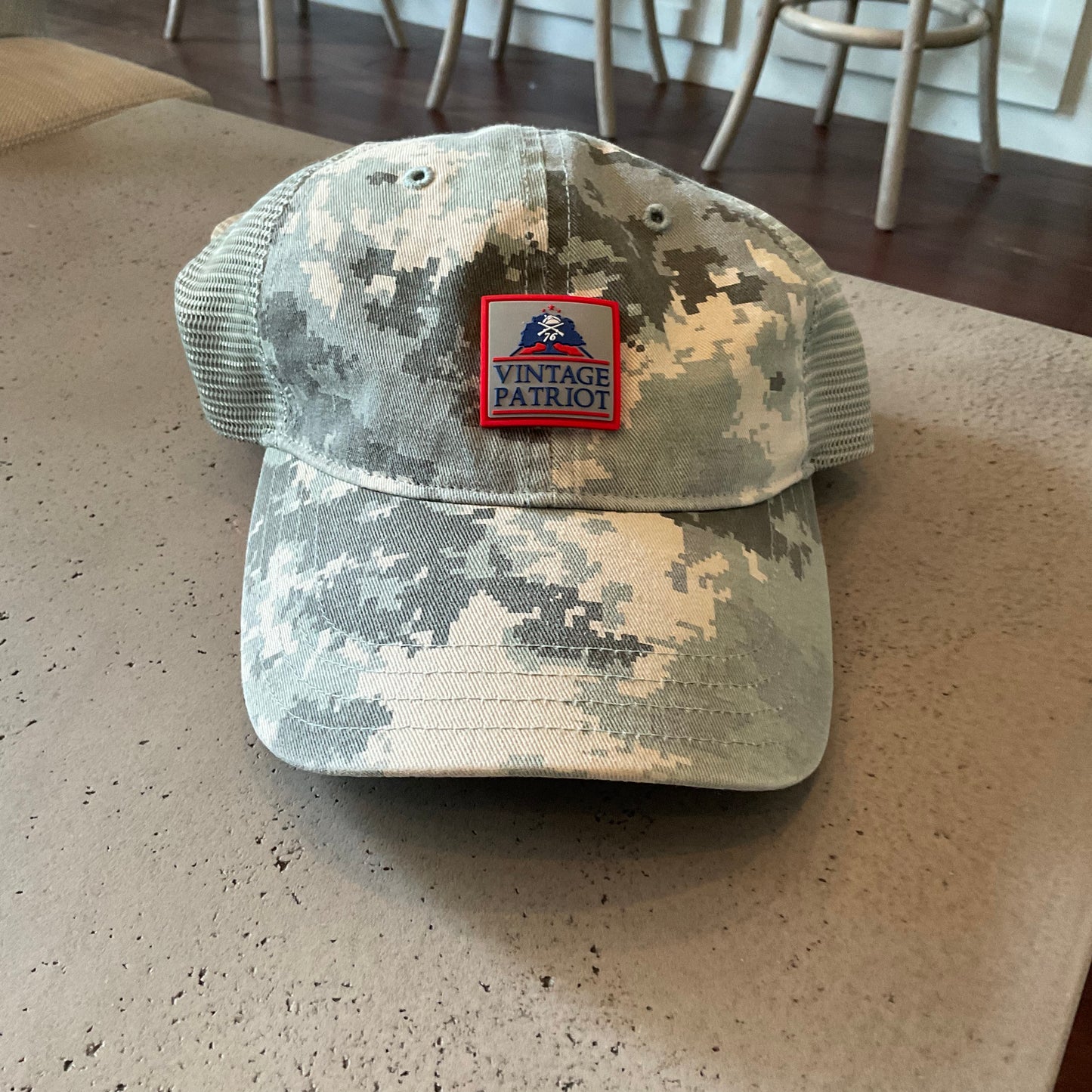 Unstructured Trucker Hat with a Rubber Vintage Patriot House Logo Patch