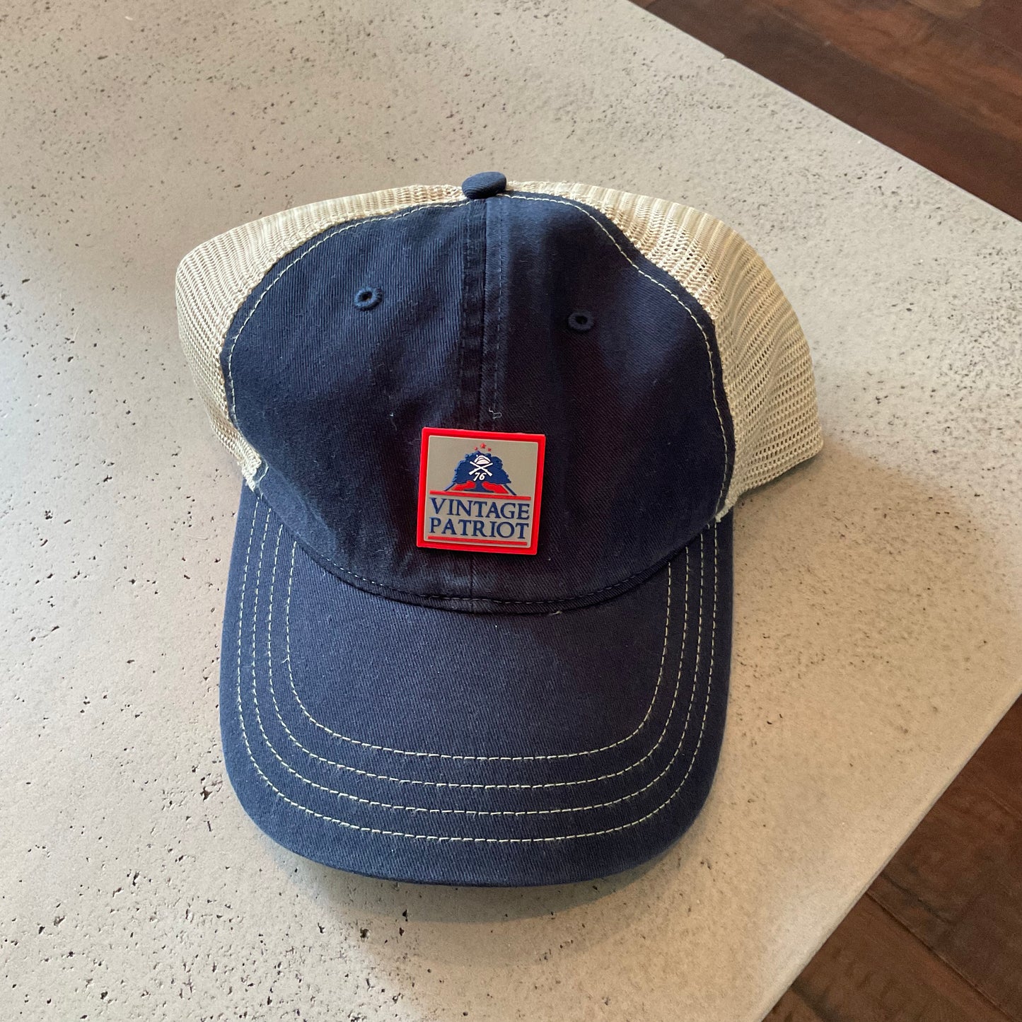 Unstructured Trucker Hat with a Rubber Vintage Patriot House Logo Patch